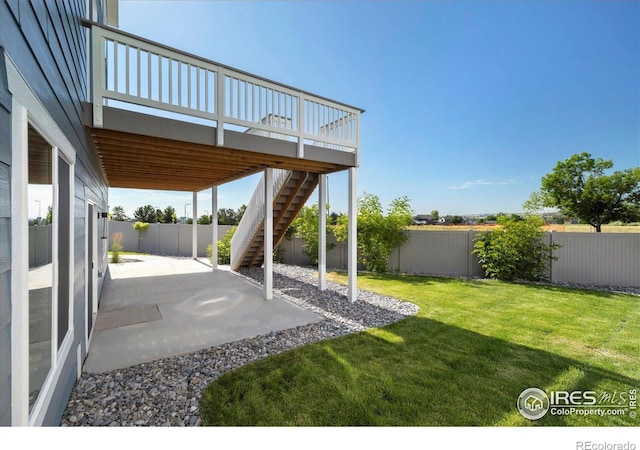 900 Eldorado Ln, Louisville, CO 80027 - fenced backyard with a patio area, stairway, and a wooden deck