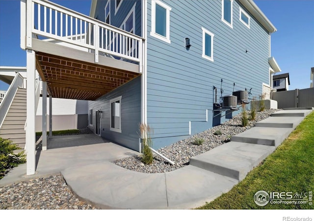 900 Eldorado Ln, Louisville, CO 80027 - view of side of home featuring a central air condition unit and a patio