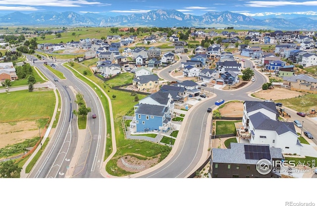 900 Eldorado Ln, Louisville, CO 80027 - aerial overview of property's location with a mountainous background and nearby suburban area