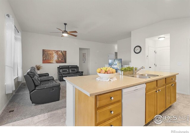 1774 Thrive Dr, Windsor, CO 80550 - kitchen featuring white dishwasher, ceiling fan, open floor plan, light countertops, and a center island with sink