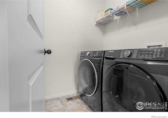 1774 Thrive Dr, Windsor, CO 80550 - laundry area featuring separate washer and dryer and baseboards
