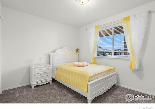 1774 Thrive Dr, Windsor, CO 80550 - bedroom featuring dark colored carpet and baseboards