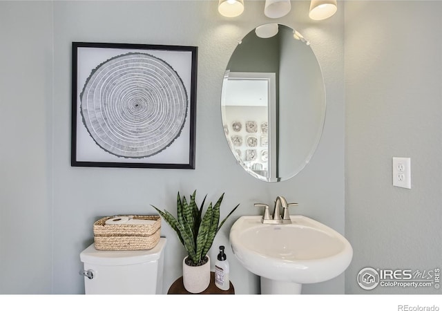 919 Schlagel St Unit 8, Fort Collins, CO 80524 - half bathroom featuring a sink and toilet