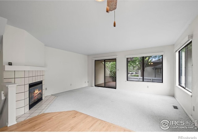 4636 Chestnut Ln, Boulder, CO 80301 - unfurnished living room with carpet floors and a tiled fireplace