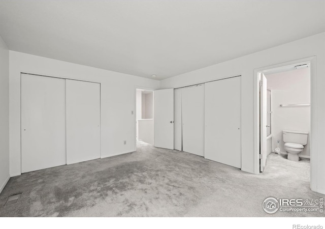 4636 Chestnut Ln, Boulder, CO 80301 - unfurnished bedroom featuring multiple closets, carpet flooring, and ensuite bath