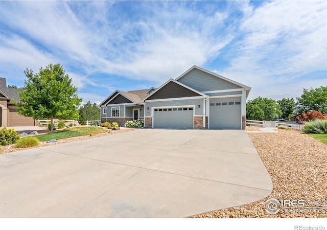 401 Cascade Ct, Johnstown, CO 80534 - craftsman inspired home with a garage, concrete driveway, and stone siding