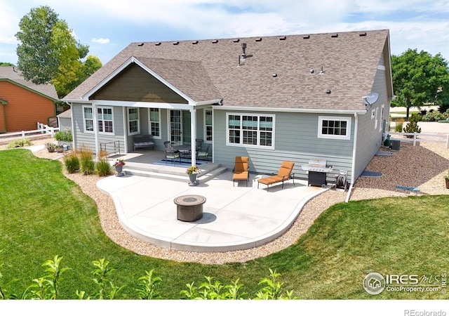 401 Cascade Ct, Johnstown, CO 80534 - back of property with a fire pit, a patio, and a shingled roof