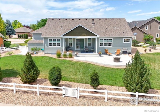 401 Cascade Ct, Johnstown, CO 80534 - back of property with a patio area, a fenced backyard, and roof with shingles