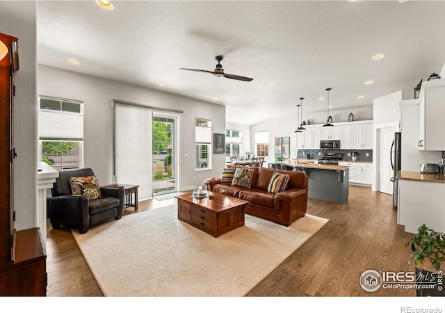 401 Cascade Ct, Johnstown, CO 80534 - living area featuring a ceiling fan, wood finished floors, and recessed lighting
