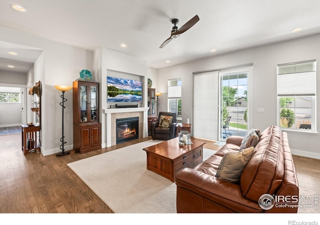 401 Cascade Ct, Johnstown, CO 80534 - living area featuring a ceiling fan, wood finished floors, a fireplace, and recessed lighting