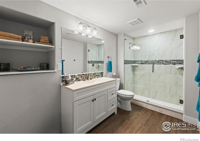 401 Cascade Ct, Johnstown, CO 80534 - bathroom with a stall shower, vanity, and wood finished floors