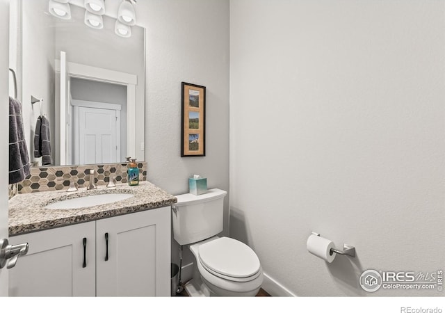 401 Cascade Ct, Johnstown, CO 80534 - half bathroom featuring vanity and backsplash