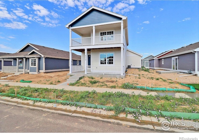 4319 Primrose Ln, Evans, CO 80620 - view of front of property featuring covered porch and a balcony