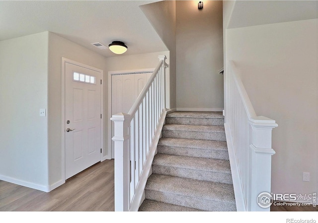 4319 Primrose Ln, Evans, CO 80620 - stairway with wood finished floors and baseboards