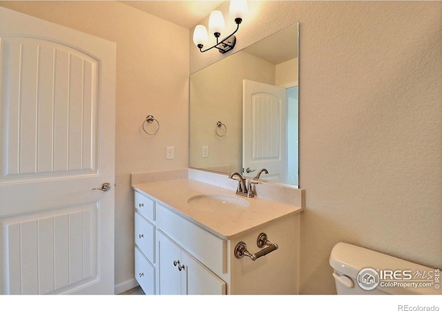 4319 Primrose Ln, Evans, CO 80620 - bathroom featuring vanity and toilet