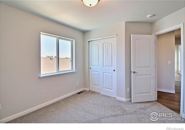 4319 Primrose Ln, Evans, CO 80620 - unfurnished bedroom with a closet and carpet