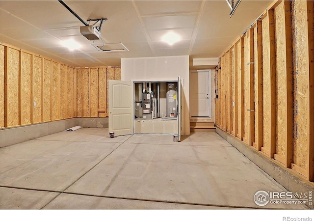 4319 Primrose Ln, Evans, CO 80620 - garage with a garage door opener and electric water heater