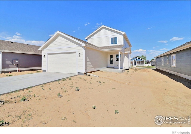 4319 Primrose Ln, Evans, CO 80620 - view of front of property with a garage and driveway