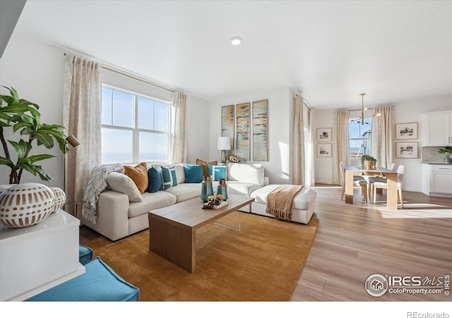 2239 Base St, Fort Lupton, CO 80621 - living area with light wood-type flooring and recessed lighting