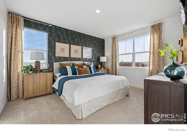 2239 Base St, Fort Lupton, CO 80621 - bedroom with wallpapered walls, multiple windows, an accent wall, carpet floors, and recessed lighting