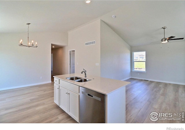 4315 Primrose Ln, Evans, CO 80620 - kitchen with dishwasher, lofted ceiling, a ceiling fan, light wood-style floors, and a center island with sink