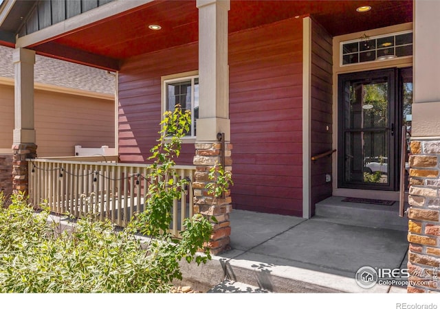 2968 Hydra Dr, Loveland, CO 80537 - property entrance featuring a porch and stone siding