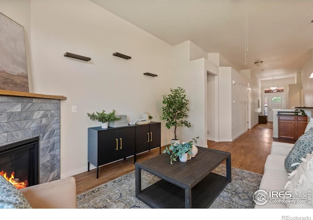 2968 Hydra Dr, Loveland, CO 80537 - living room with a glass covered fireplace and light wood-style floors