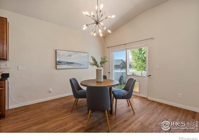 2968 Hydra Dr, Loveland, CO 80537 - dining area with a chandelier, light wood finished floors, and lofted ceiling