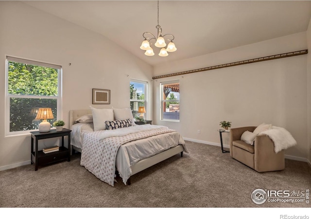 2968 Hydra Dr, Loveland, CO 80537 - bedroom with a chandelier, vaulted ceiling, multiple windows, and carpet flooring