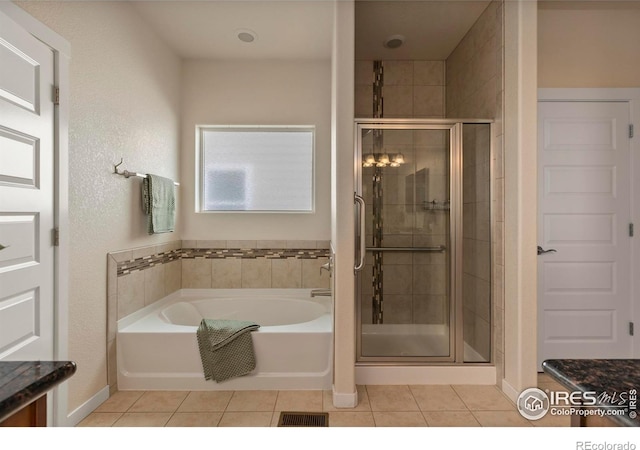 2968 Hydra Dr, Loveland, CO 80537 - bathroom with tile patterned flooring, a bath, a shower stall, and vanity