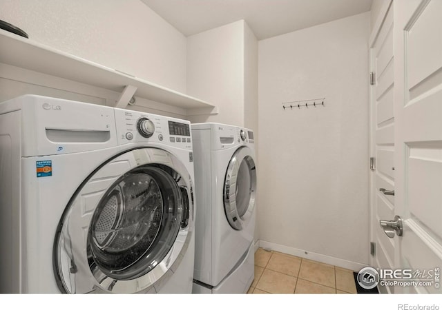 2968 Hydra Dr, Loveland, CO 80537 - laundry area featuring separate washer and dryer and light tile patterned floors