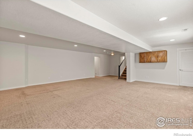 2968 Hydra Dr, Loveland, CO 80537 - finished below grade area with light colored carpet, recessed lighting, and stairway