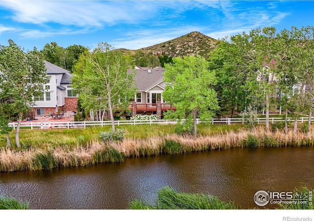 4283 Golf Vista Dr, Loveland, CO 80537 - back of house featuring a deck with water view