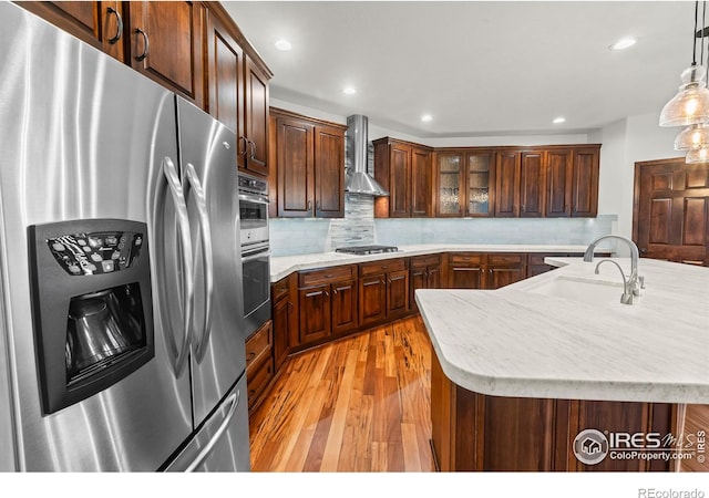 4283 Golf Vista Dr, Loveland, CO 80537 - kitchen featuring stainless steel appliances, wall chimney range hood, light wood-type flooring, light countertops, and recessed lighting