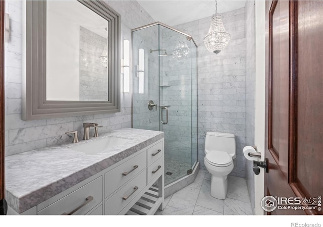 4283 Golf Vista Dr, Loveland, CO 80537 - full bathroom with vanity, marble finish floors, a shower stall, and a chandelier