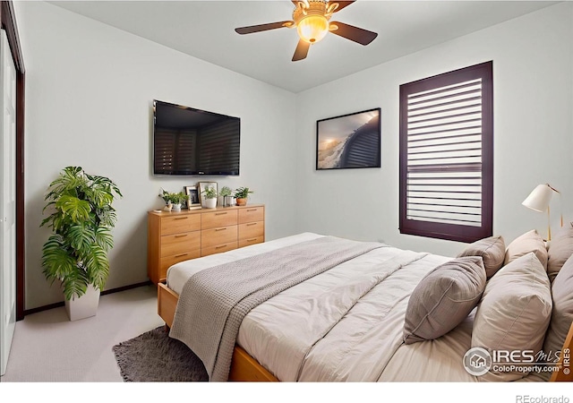 4283 Golf Vista Dr, Loveland, CO 80537 - carpeted bedroom with baseboards and ceiling fan