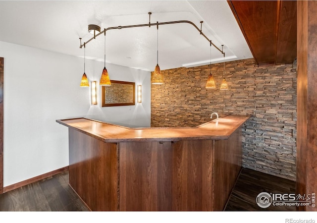 4283 Golf Vista Dr, Loveland, CO 80537 - indoor wet bar featuring dark wood-style floors and decorative light fixtures