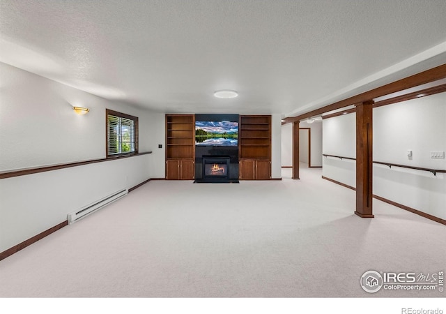 4283 Golf Vista Dr, Loveland, CO 80537 - unfurnished living room with baseboard heating, a textured ceiling, a warm lit fireplace, and carpet flooring