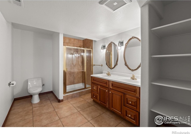 4283 Golf Vista Dr, Loveland, CO 80537 - bathroom with double vanity, a stall shower, tile patterned flooring, a textured ceiling, and built in shelves