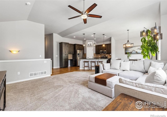 1625 Glacier Ave, Berthoud, CO 80513 - carpeted living area with ceiling fan and lofted ceiling
