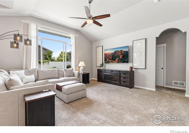 1625 Glacier Ave, Berthoud, CO 80513 - living room with lofted ceiling, a ceiling fan, carpet, and arched walkways