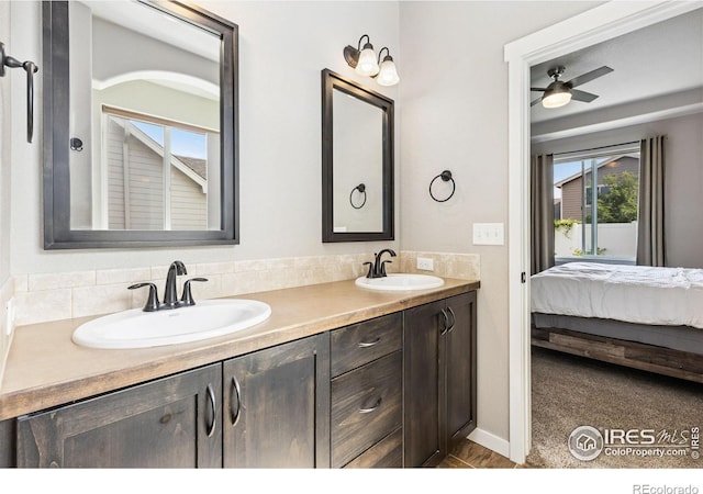 1625 Glacier Ave, Berthoud, CO 80513 - full bathroom with double vanity, ensuite bath, and ceiling fan
