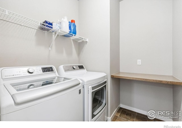 1625 Glacier Ave, Berthoud, CO 80513 - washroom with washing machine and dryer and baseboards