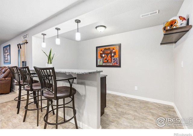 1625 Glacier Ave, Berthoud, CO 80513 - bar featuring pendant lighting and baseboards