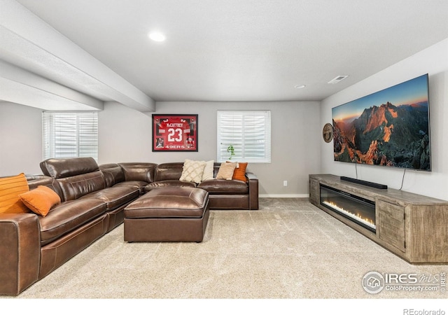 1625 Glacier Ave, Berthoud, CO 80513 - carpeted living room featuring recessed lighting and a glass covered fireplace