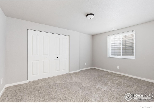 1625 Glacier Ave, Berthoud, CO 80513 - unfurnished bedroom with carpet and a closet