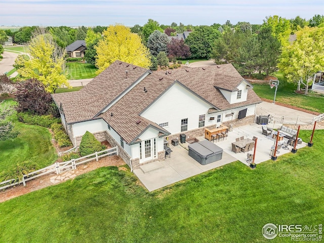 1115 Kestrel Rd, Eaton, CO 80615 - rear view of house featuring an outdoor living space, a patio area, a fenced backyard, and stone siding