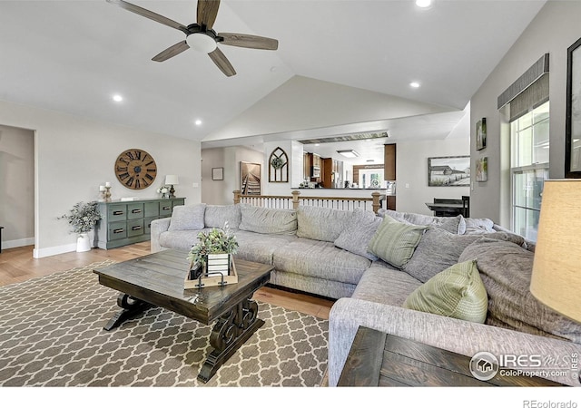 1115 Kestrel Rd, Eaton, CO 80615 - living room with ceiling fan, vaulted ceiling, wood finished floors, and recessed lighting