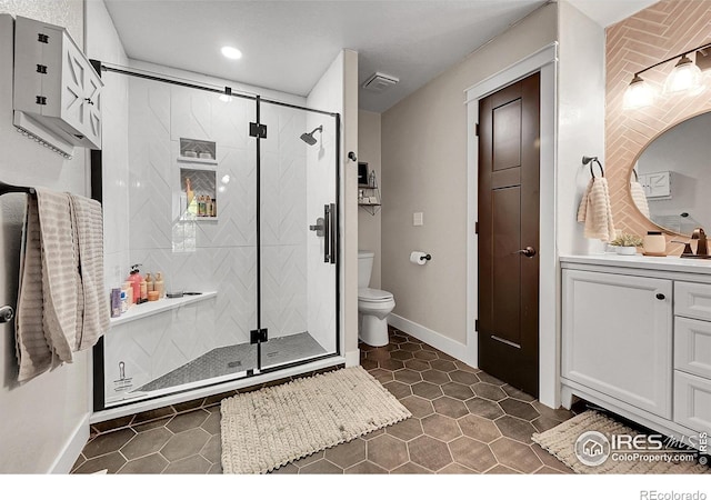 1115 Kestrel Rd, Eaton, CO 80615 - bathroom featuring vanity, a shower stall, recessed lighting, and tile patterned floors