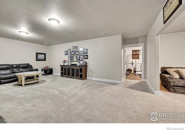 1115 Kestrel Rd, Eaton, CO 80615 - carpeted living room with a textured ceiling and baseboards